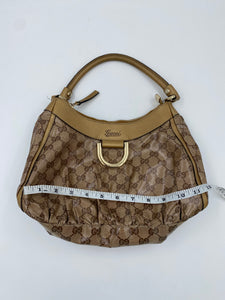 Gucci Gold Coated Canvas Abbey